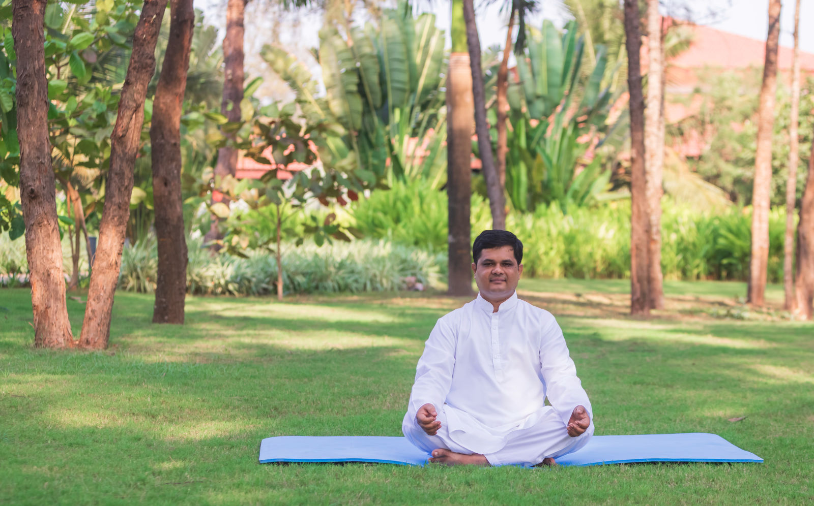 a person practising yoga at gamyam beach resort