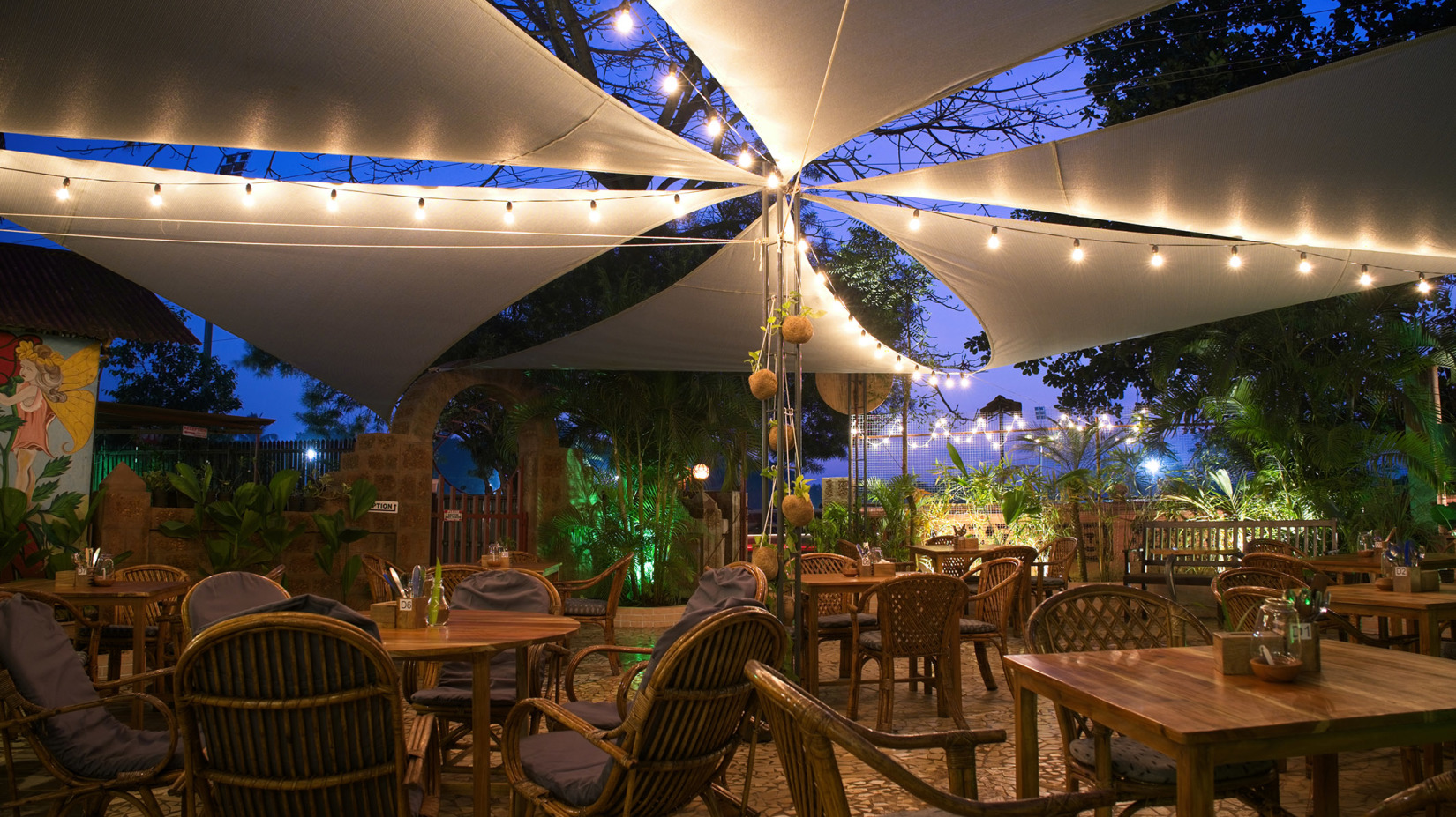 a well-lit restaurant at night at villa in palms