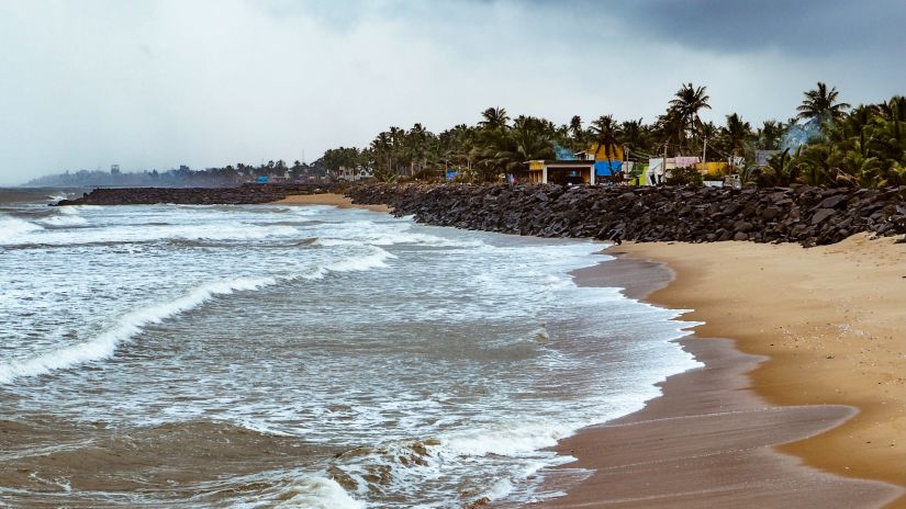 Symphony Resorts - waves lapping on a beach in Pondy