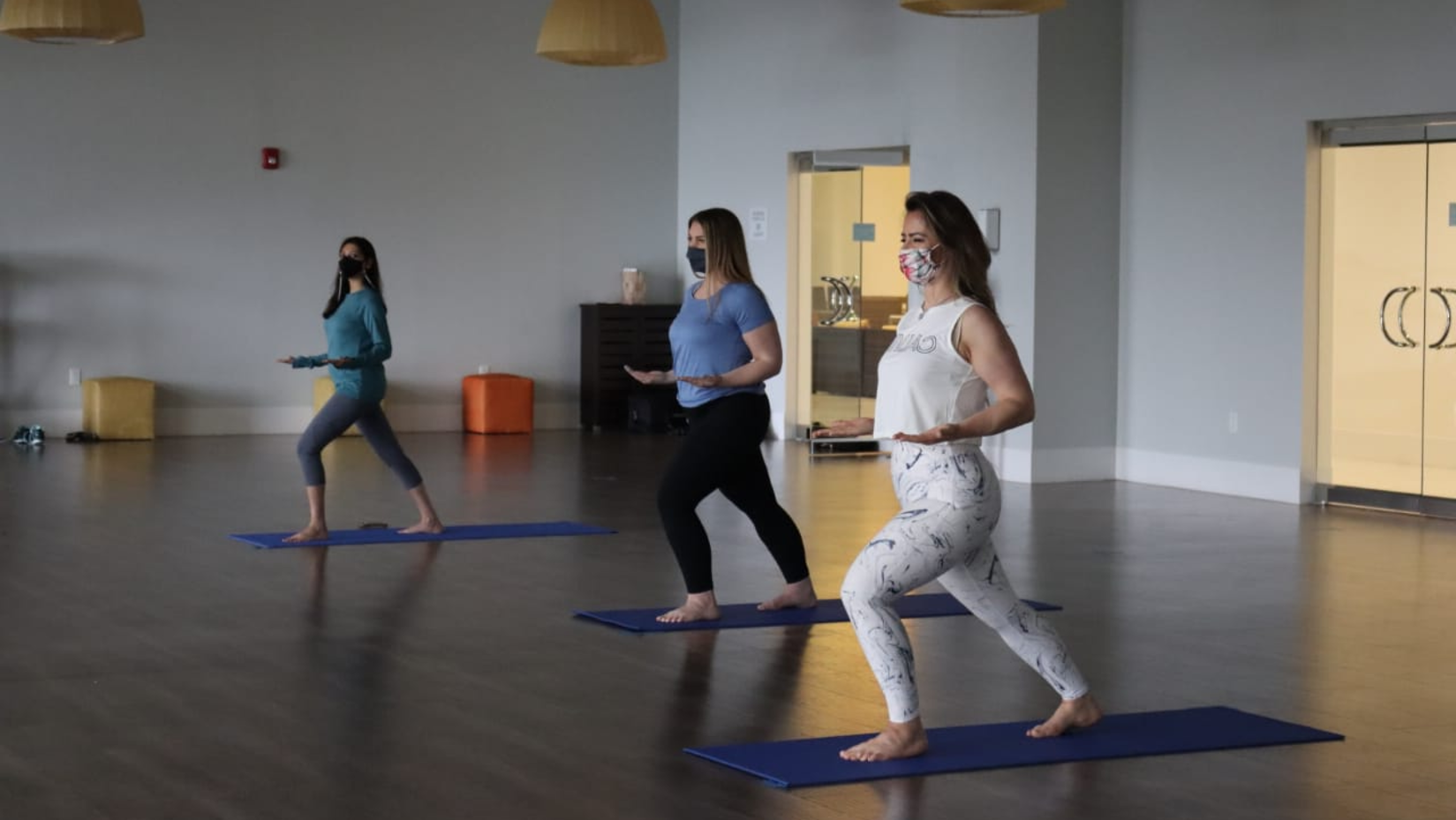 people doing yoga in a room