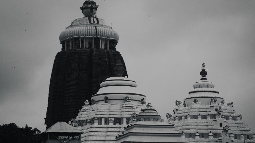 a black and white image of a hindu temple with a flag placed on its Shikhara