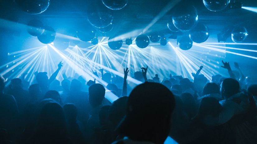 People dancing inside a neon-lit club - Richmonde Ananta Elite Goa