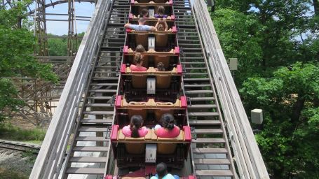 People seated on a roller coaster