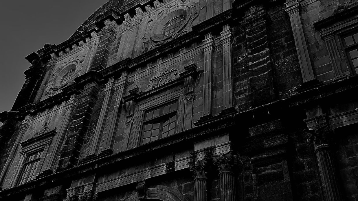 A worm s eye view of large building of baroque architecture in black and white ibn2fw