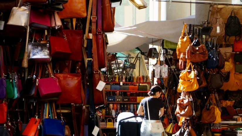 Lady street shopping for handbags