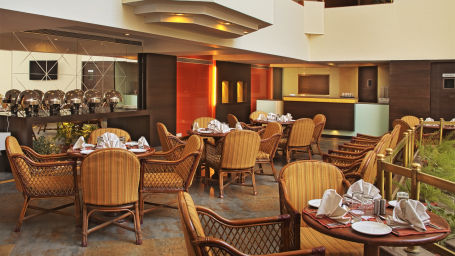 seating arrangements inside VITS Snax at VITS Luxury Business Hotel Aurangabad