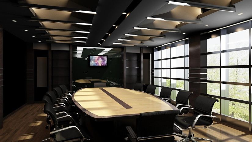 a meeting room featuring a projector and seating arrangements