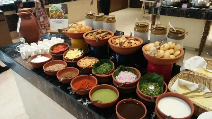 A variety of Chaats arranged on a counter - Pride Hotels