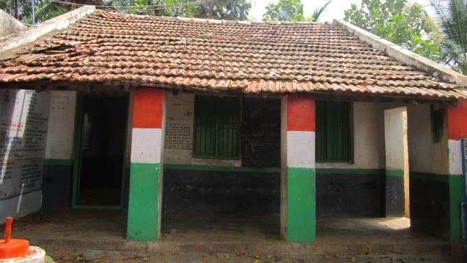 old building with tricolour pillars