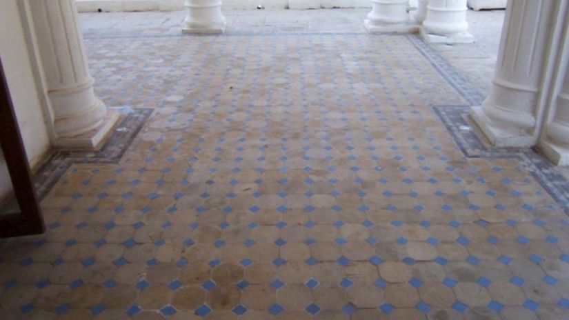 tiles lines up on the floor with columns on the side and background - The Baradari Palace