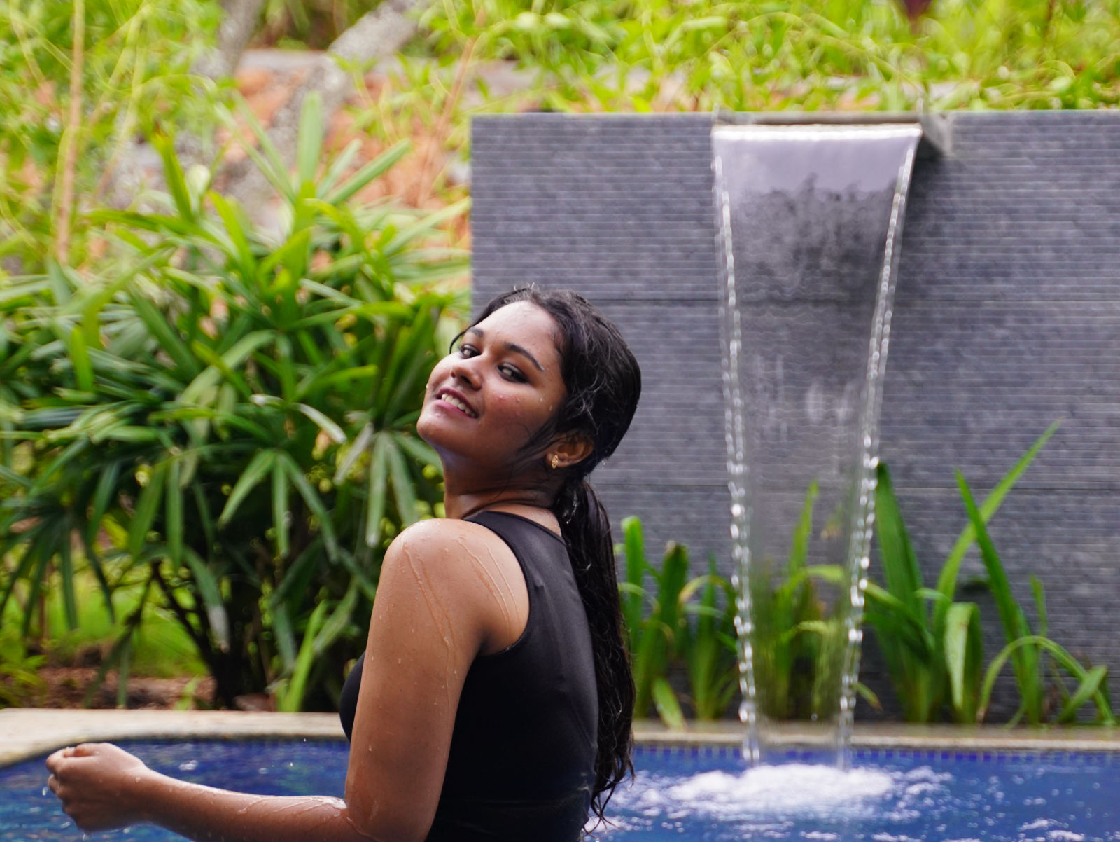 Ravishing Retreat Ramanagara - A guest relaxing in the private pool at our resort