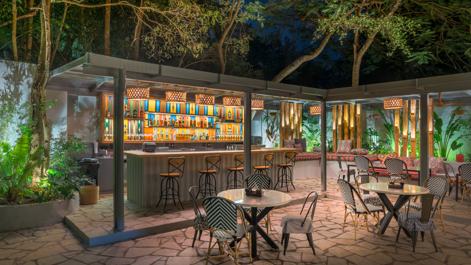 The Village 36 Bar features an outdoor serving counter stocked with drinks and a dining area