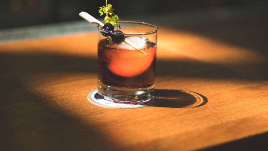 A close-up shot of an alcoholic drink on the table in the bar at Mastiff Xanadu in Manali