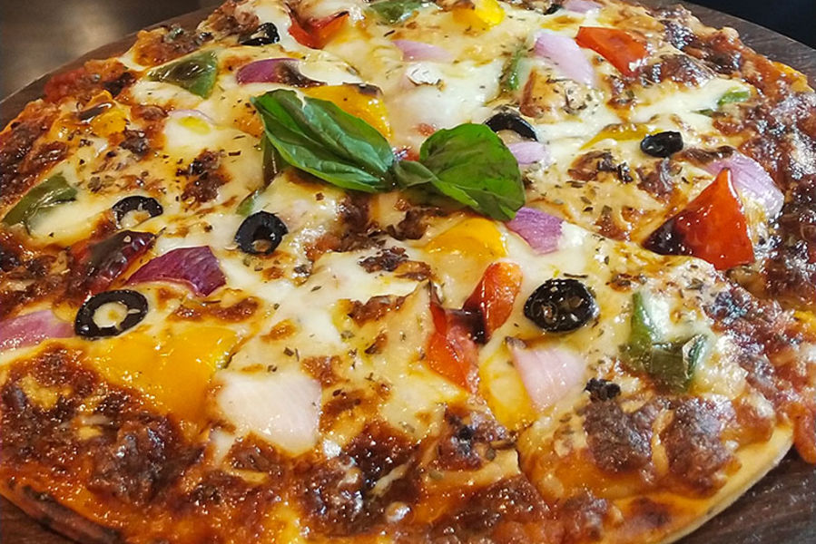 alt-text pizza marinara offered at Ginger, a restaurant in Shillong