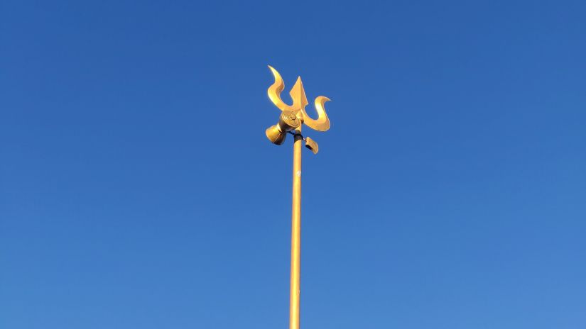 Shiva's trishula standing against the backdrop of the blue sky -Fort JadhavGADH 