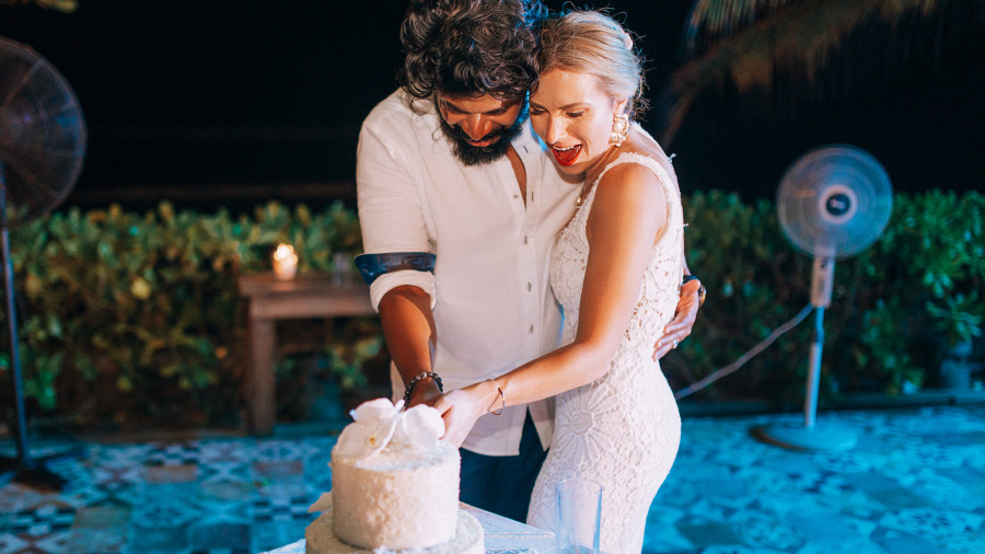 couple cutting wedding cake