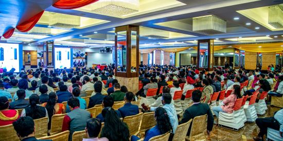 alt-text A back view of a conference hall with chairs occupied by poeple Sun Park Hotel & Banquet, Chandigarh - Zirakpur