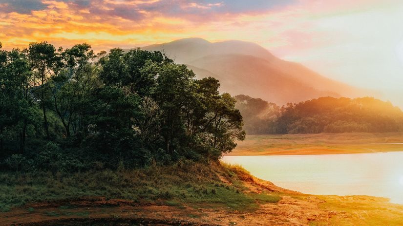 a water body with mountains in the background