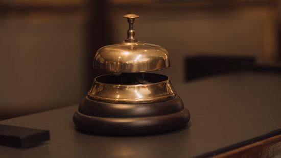 close up of a gold bell on a desk