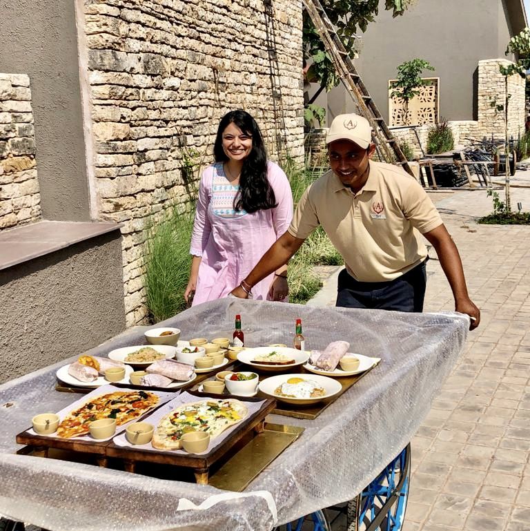 Hotel staff driving food cart