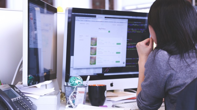 Woman looking at a computer system