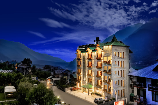 alt-text Night view of the facade of  Summit Chandertal Regency Hotel & Spa 