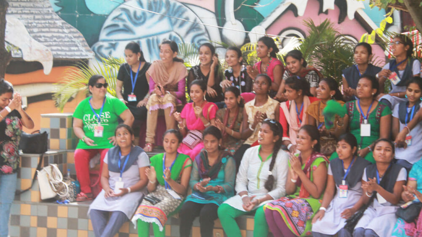 a group of school children and adults posing for a picture 