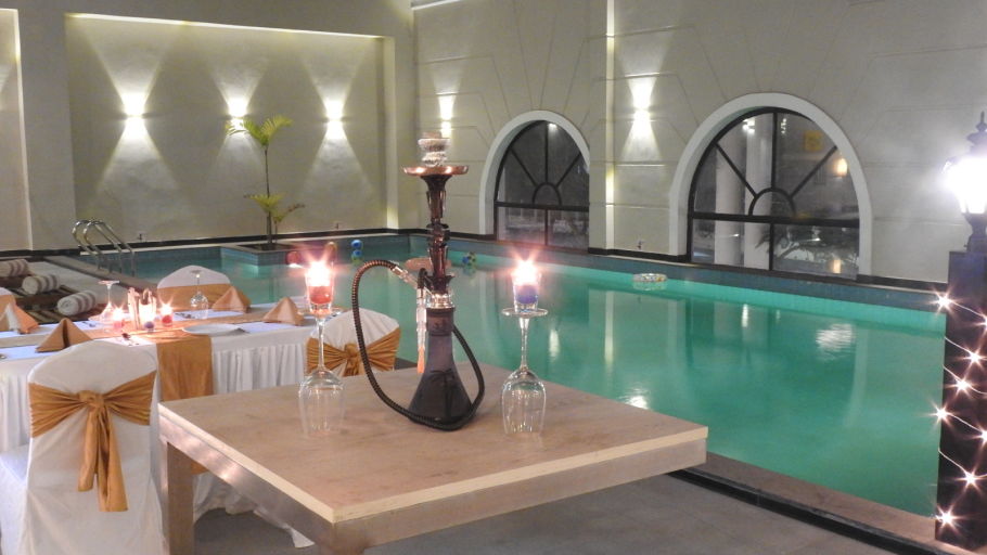 tables beside the pool at Skygrill - best pool side restaurant in Agartala - Hotel Polo Towers Agartala