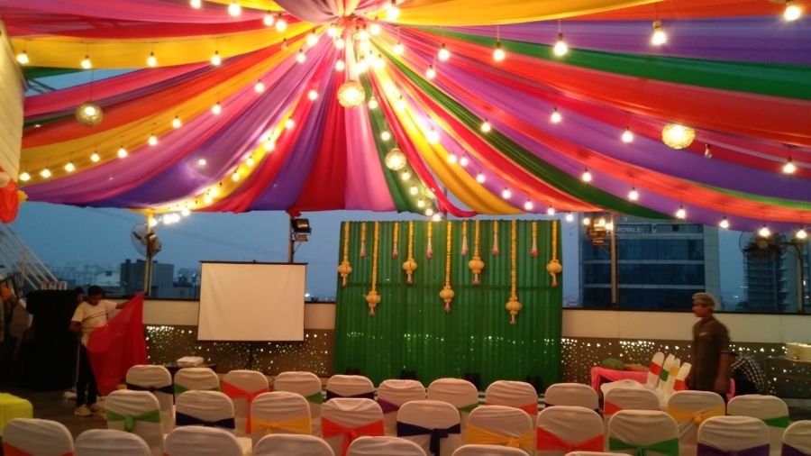 Image of an outdoor event space with chairs and light above at The Oriental Residency