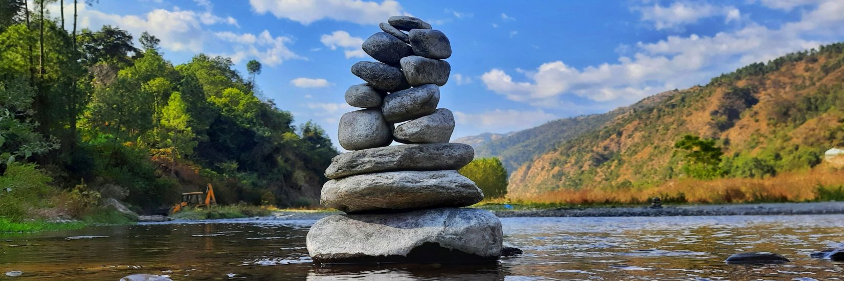 A stack of rocks placed on top of each other on a lake