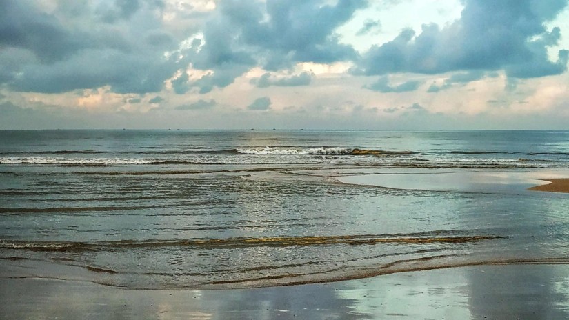 colourful reflection of the sky at a beach