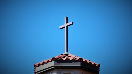 The Holy Cross located above a Church building