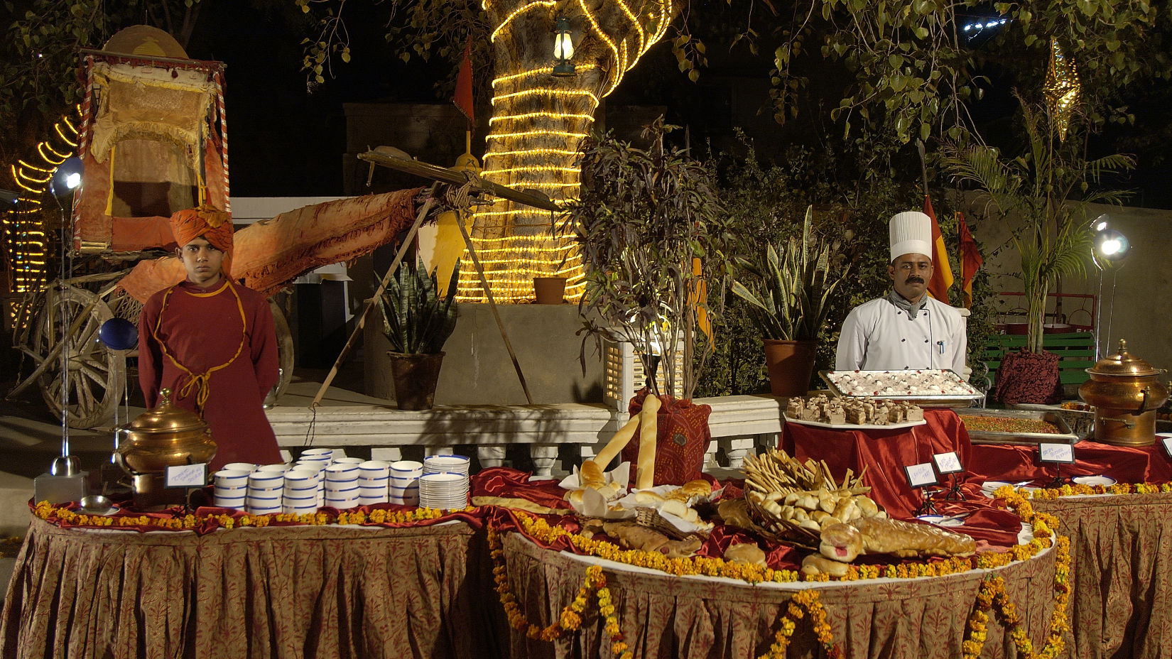 Gala Dinner at Gulab Bagh with people serving food  - Hotel Castle Mandawa, Jhunjunu