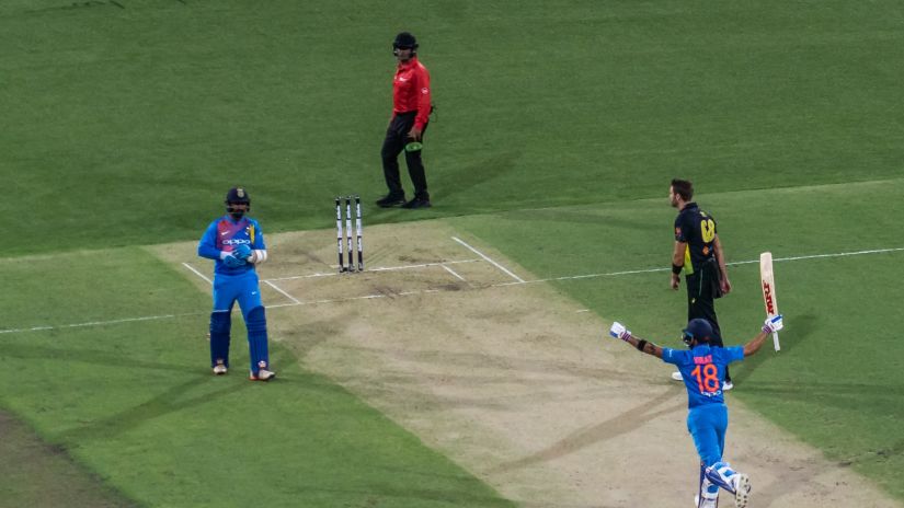 cricketers celebrating after winning a match