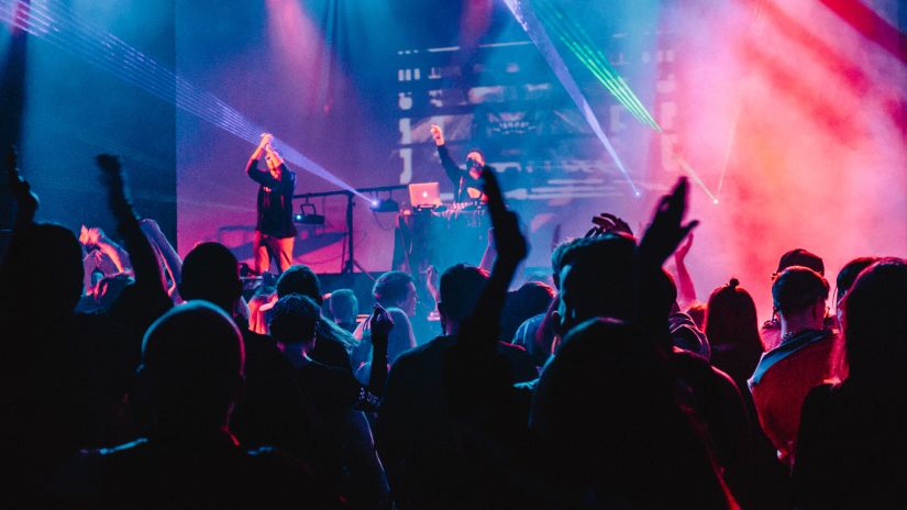 people partying in colourful lights