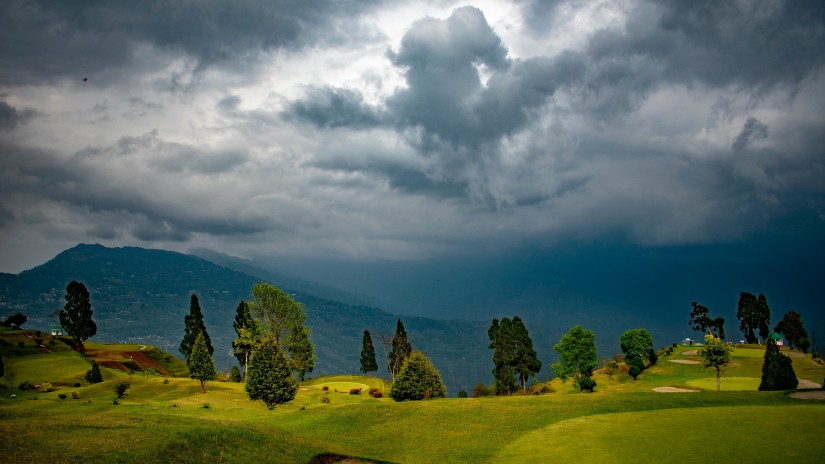 lush green deolo hills under an overcast sky