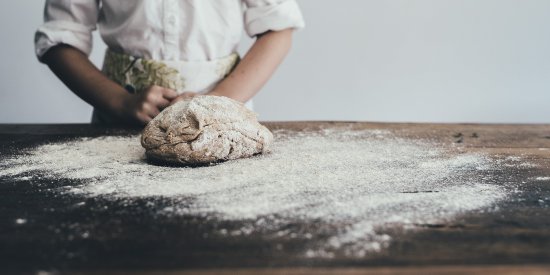 a man kneading dough