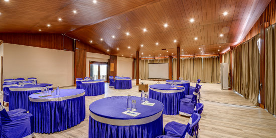 alt-text A spacious area with a round seating arrangement in the Conference Hall at Silver Sand Beach Resort, Havelock.