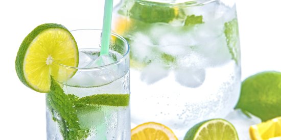 a jar and glass of lemon and mint water