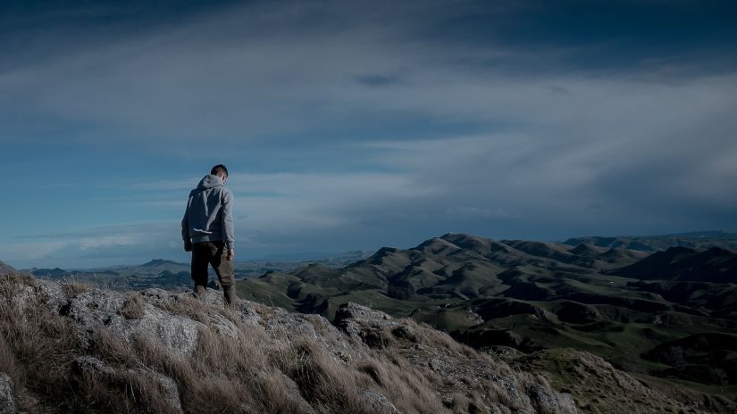 person trekking on a hill