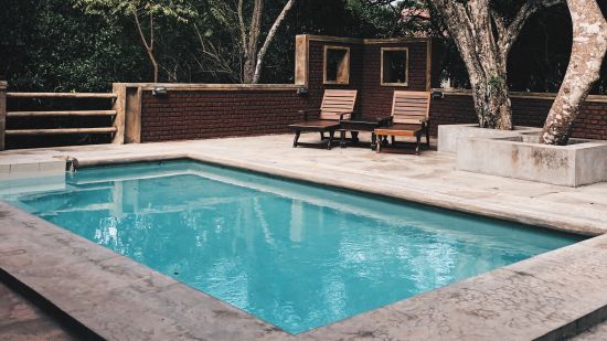 Image of a swimming pool @ Lamrin Ucassaim Hotel, Goa