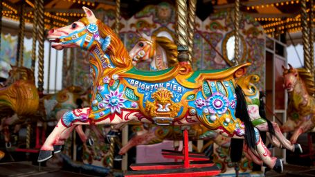 a shot of a horse in a merry go round