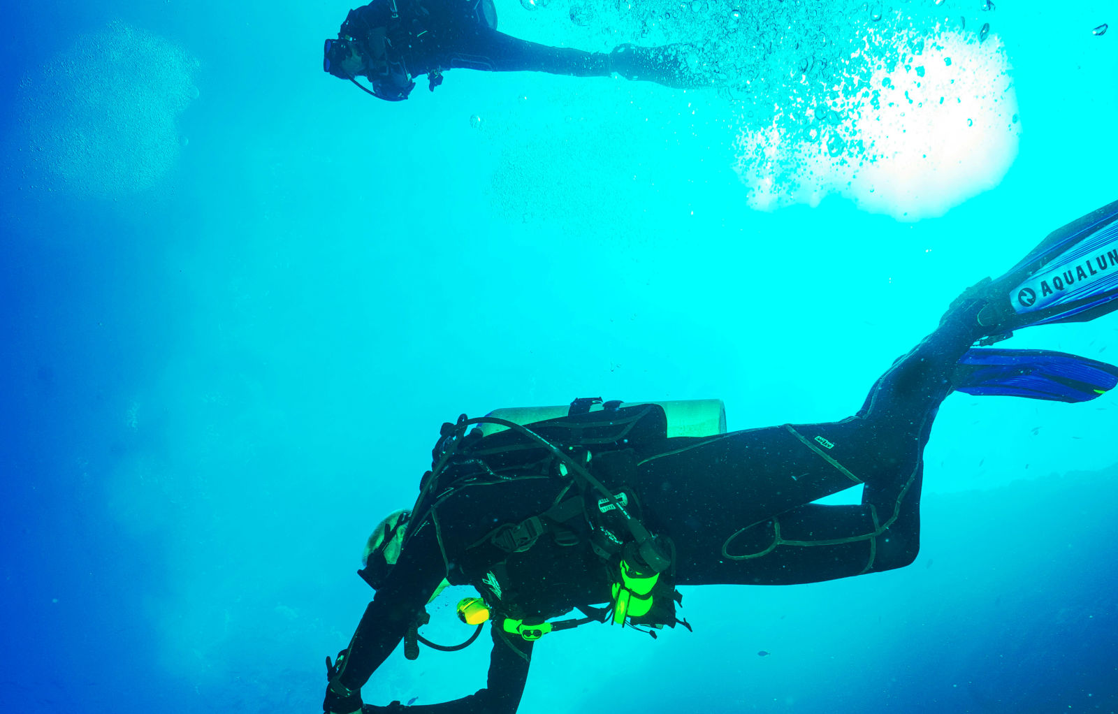 two scuba divers underwater