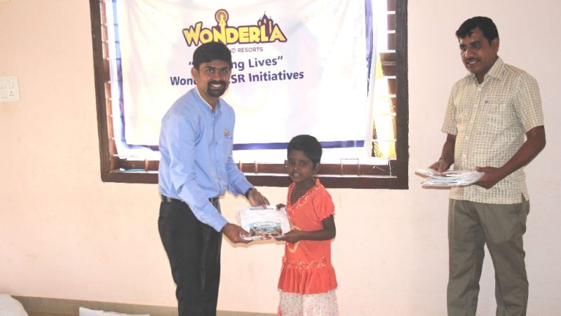 student being gifted a uniform