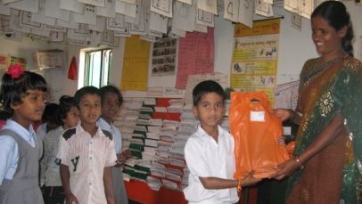 student being gifted an orange packet