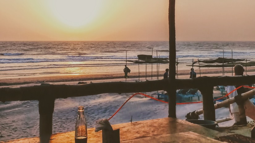 shack on a beach during a sunset