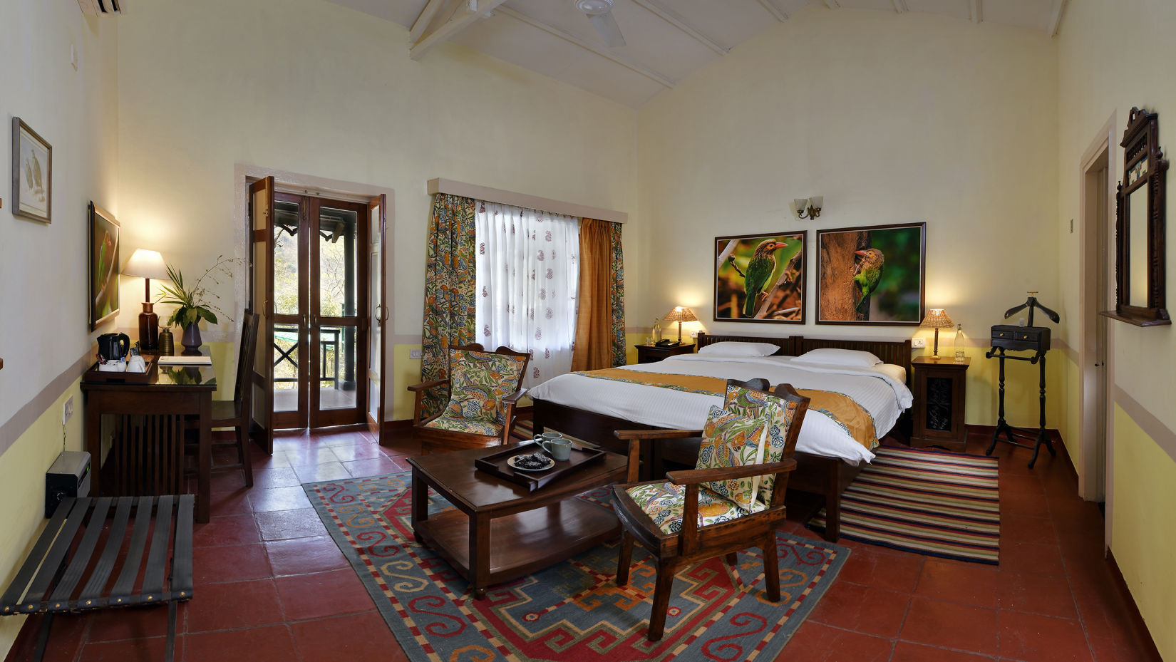 Barbet room comprising of a bed, coffee table and chairs 