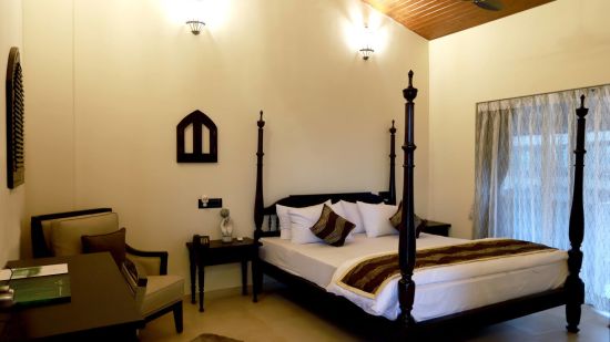 bedroom with ceiling fan, chair and cupboard - Mastiff Grand La Villae Resort, Lonavala