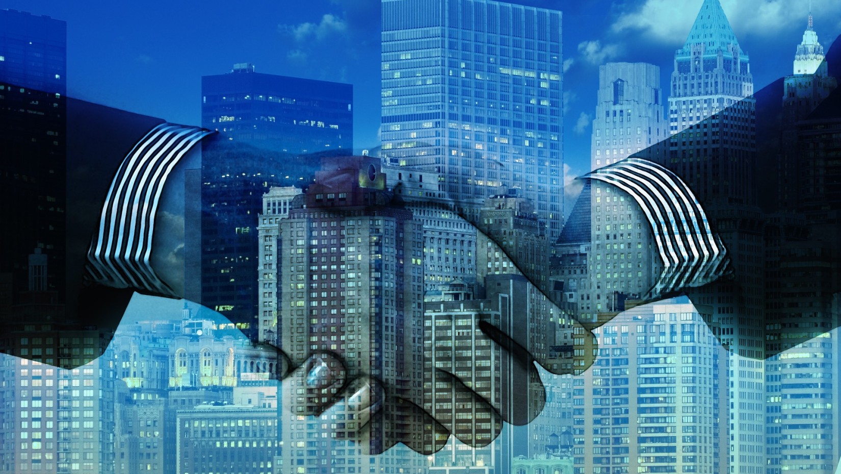 Two people shaking hands with buildings overlapping on the image