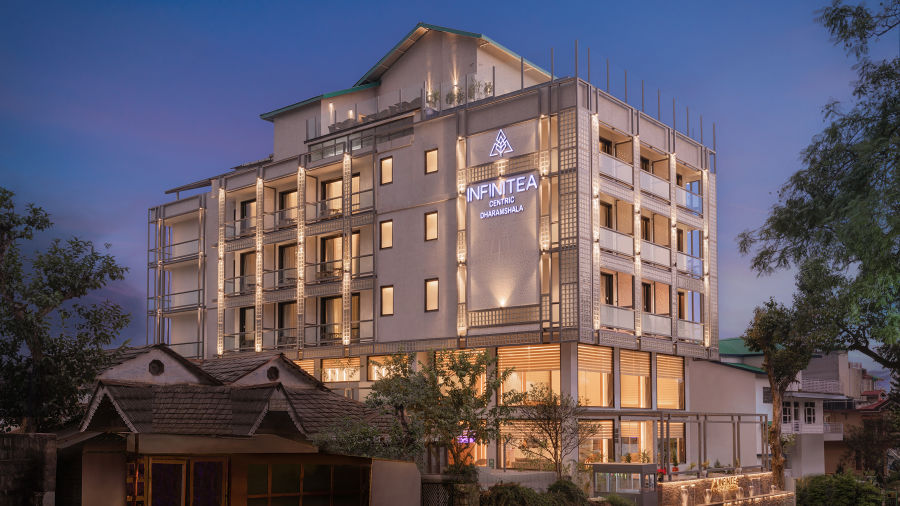 Facade of Infinitea Centric, Dharamshala during blue hour and clear skies